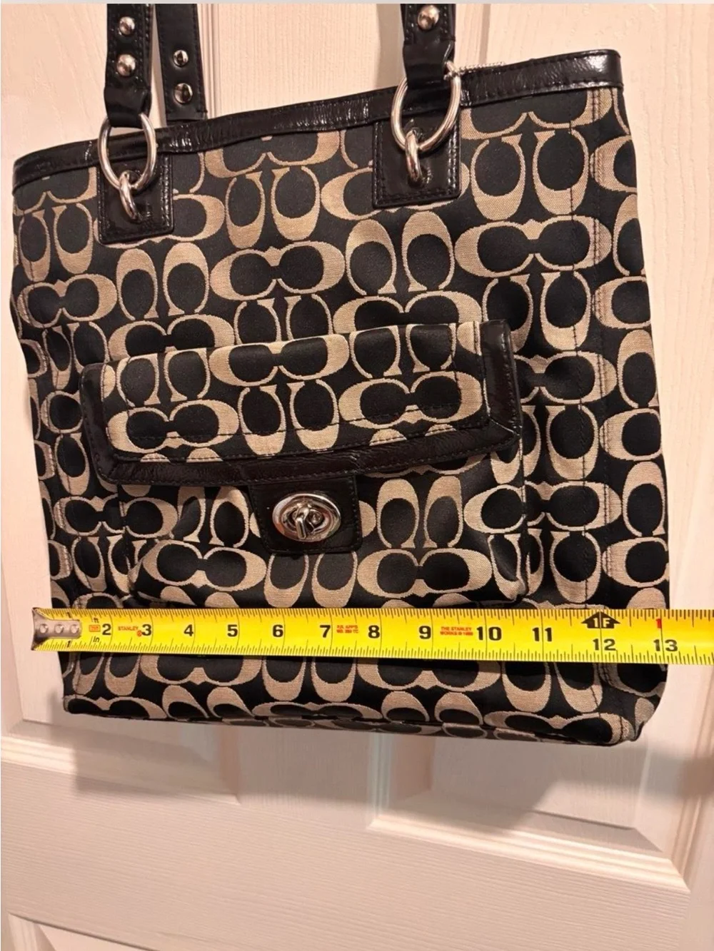 Coach Black and Beige Signature Tote with Front Turn-Lock Pocket